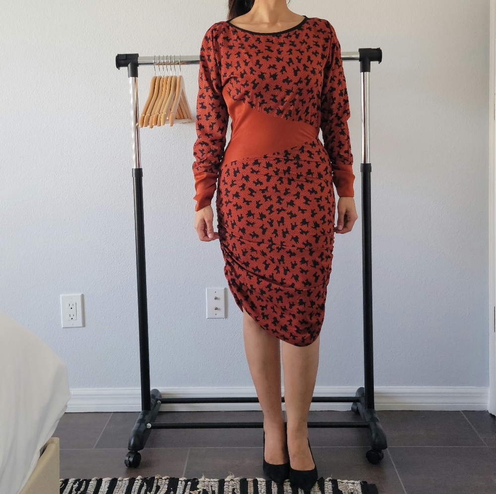 Long sleeve red bodycon dress with puppy pattern.